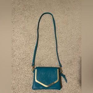 Charming Charlie's cross body teal purse
